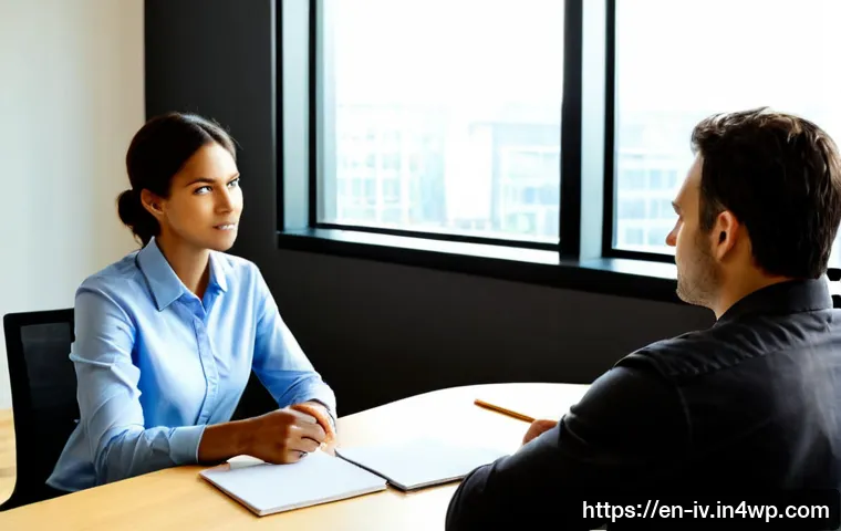 Home 17 지식의 한계 인식과 갈등 관리 - Photorealistic workplace meeting showing two diverse colleagues calmly resolving a disagreement acro...